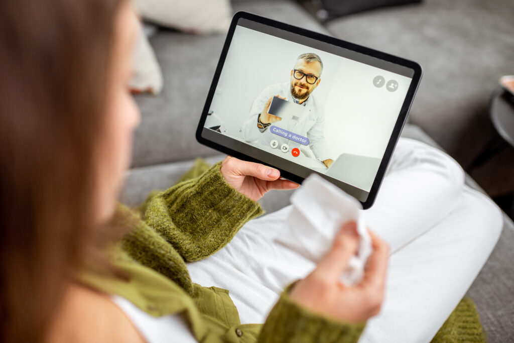 Digital Transformation, Virtual Care Consultation - Woman with tablet calling a virtual doctor