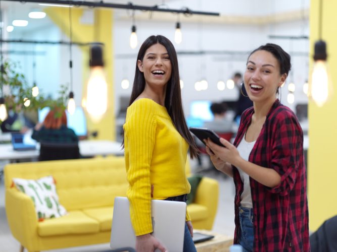 group of female friends having a team meeting and discussion about project or in modern startup business open space coworking office