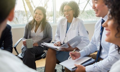 doctors stting in a circle discussing