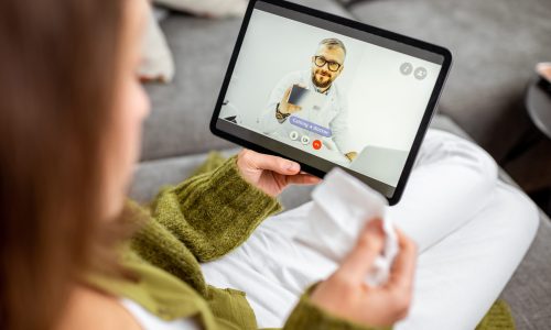 Virtual Care Consultation - Woman with tablet calling a virtual doctor