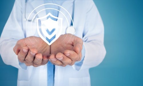 healthcare doctor holding cybersecurity shield