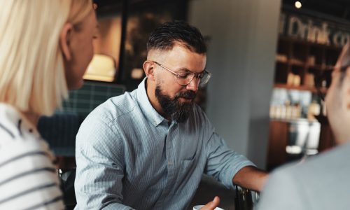 Businessman having a casual team meeting