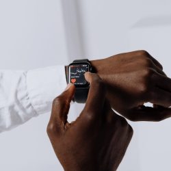 person touching smartwatch